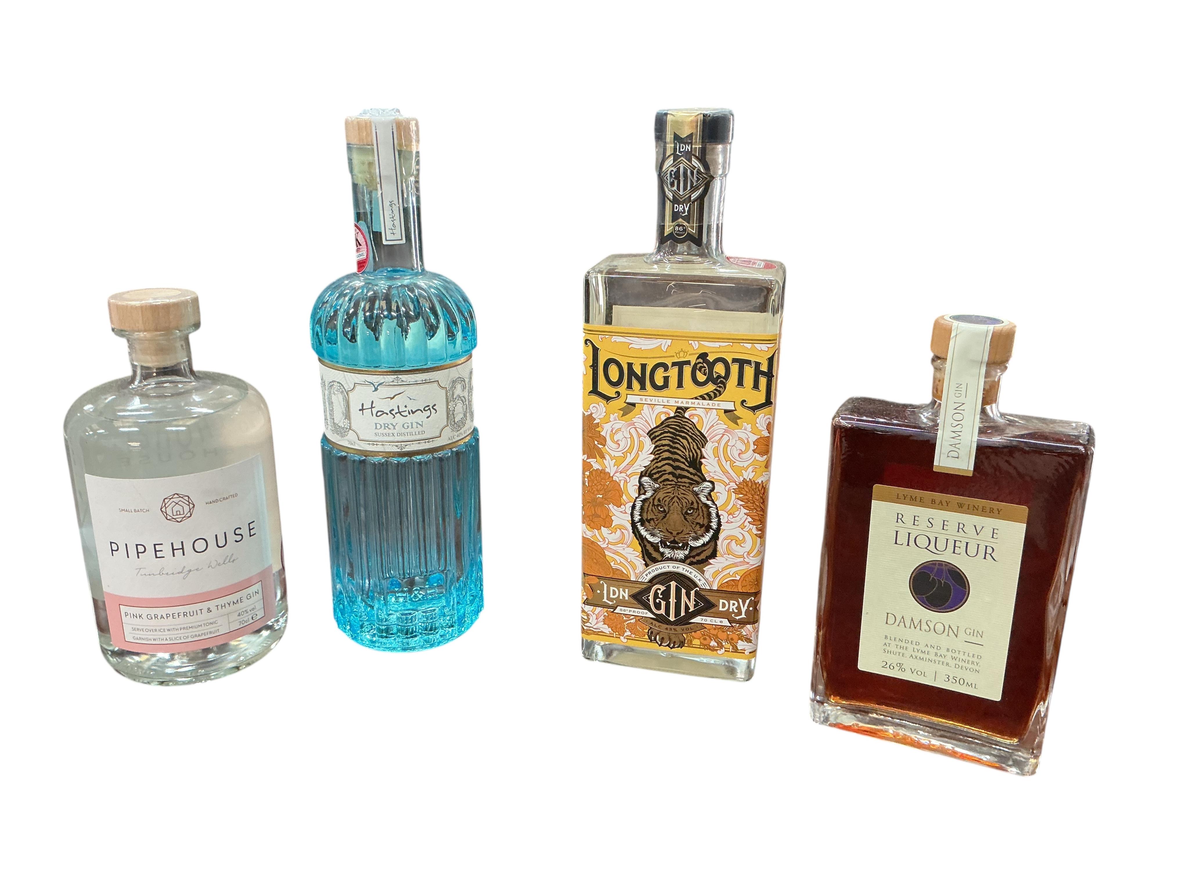 Four bottles of British artisan gin, a bottle of Tanqueray Sevilla and Bombay Sapphire gin and a bottle of Campari. (Provenance, surplus stock from a local wedding company)